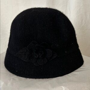 AUGUST Black Wool Blend Cloche Hat with flower on side.
